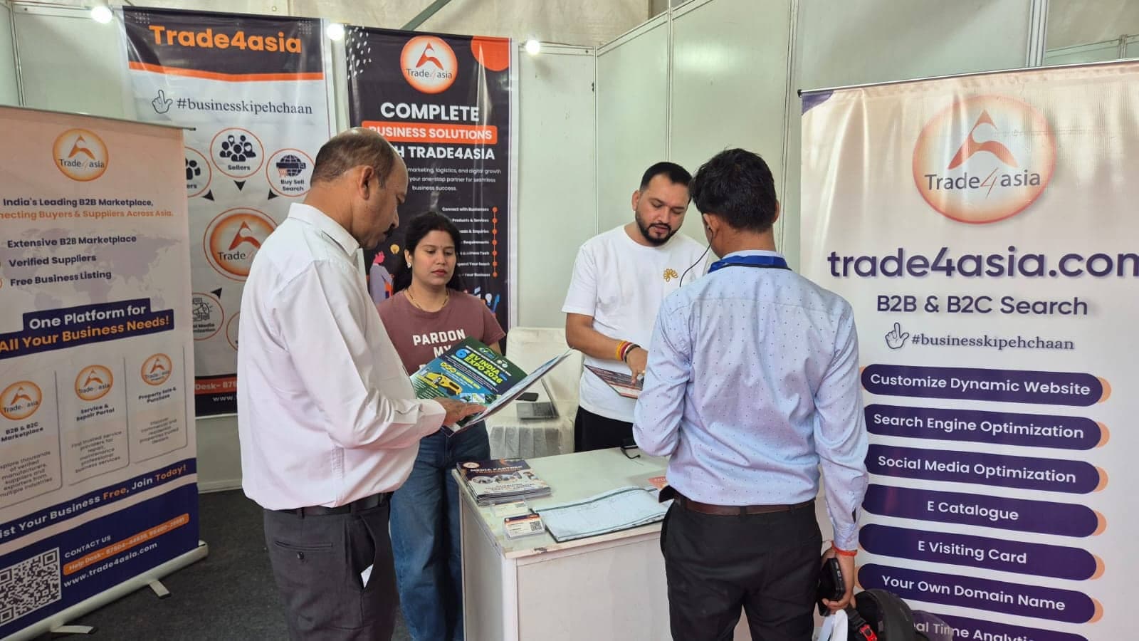 Business professionals discussing products at a trade exhibition